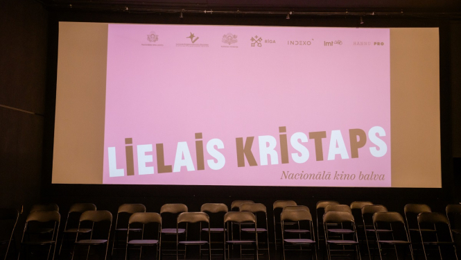 Lielā Kristapa plakāts uz ekrāna