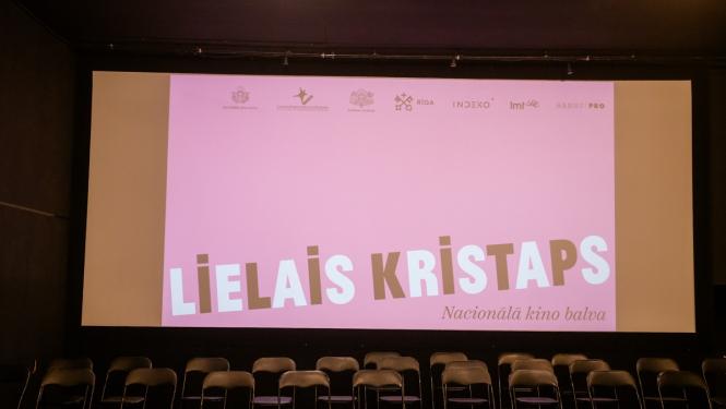 Lielā Kristapa plakāts uz ekrāna