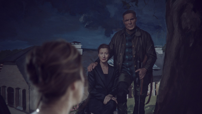 filmas kadrs ar plakātu