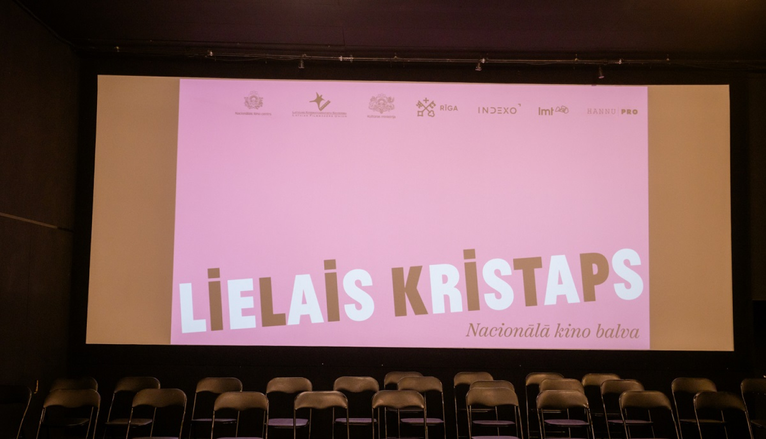 Lielā Kristapa plakāts uz ekrāna